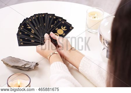 Soothsayer With Tarot Card At Table, Closeup