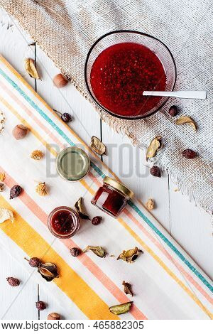 Jam In A Jar And A Spoon. Apple And Pear Jam In A Spoon On A White Mirror Background. Healthy Natura