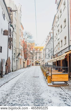 Riga, Latvia - November 20 2022: Beautiful Narrow Street With Cobblestones In Riga Old Town With Hou
