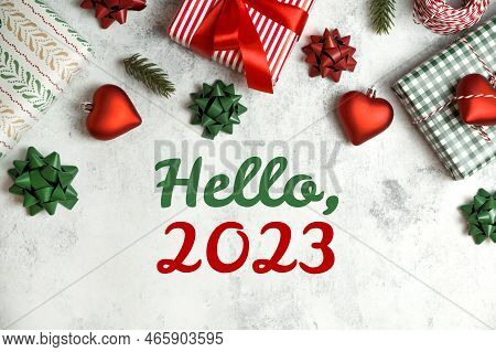 Hello 2023 Text Surrounded With Ornamnet,gifts,bows,etc In Red,white And Gree. Traditional Flat Lay