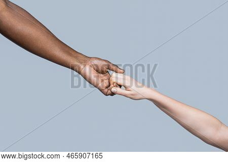 Woman And African Woman Hand. Helping Hand, Rescue, Multiathnic People. Helping Hands, Rescue Gestur