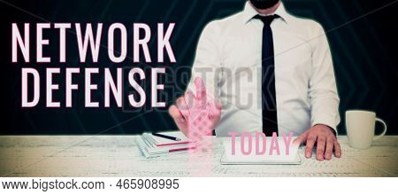 Hand Writing Sign Network Defense. Word For Easures To Protect And Defend Information From Disruptio