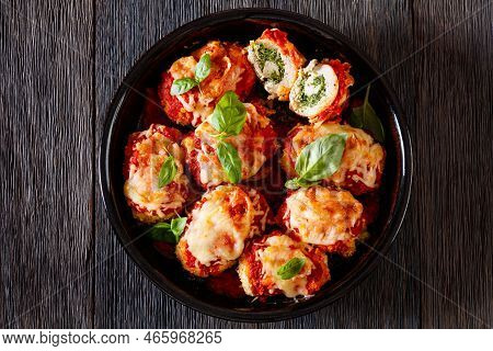 Chicken Rollatini With Spinach Ricotta Filling In Marinara Sauce Topped With Mozzarella Cheese And F
