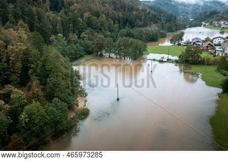 Flash Flood Caused By Heavy Rainfall, A Torrent From Mountain Stream Ripping Through The Forest Into