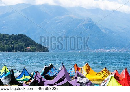 Kite Surfing Board And Kites Against Lake And Mountains, Kite Surfing At Como Lake, Alps, Italy. Act