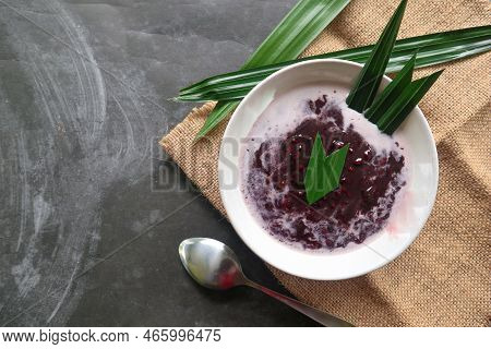 Black Sticky Rice Porridge In A Bowl. Bubur Ketan Hitam