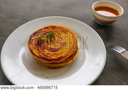 Paratha Bread Or Canai Bread Or Roti Maryam, Favorite Breakfast Dish. Served On Plate