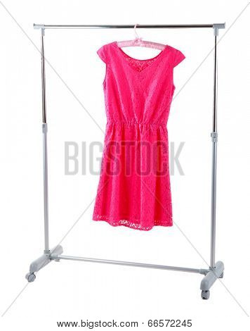 Beautiful pink dress hanging on hangers isolated on white