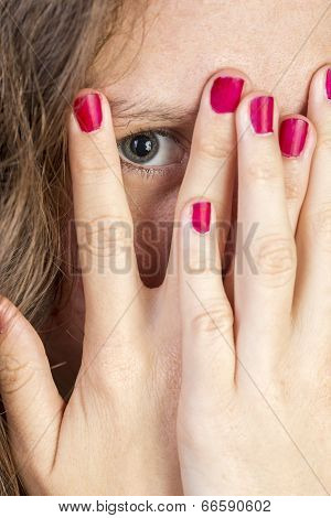 Teen Peeking Thorugh Fingers