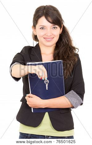 portrait of beautiful woman real estate agent holding a key