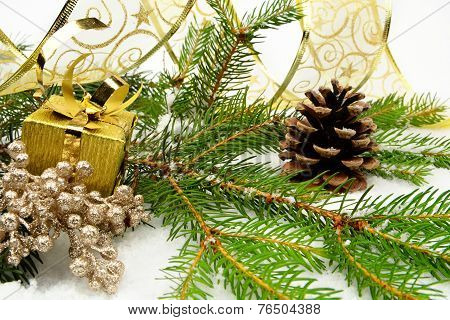 Golden Christmas Gifts With Golden Ribbon And Needles Fir With R