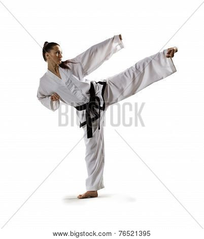 Karate woman in action isolated on white