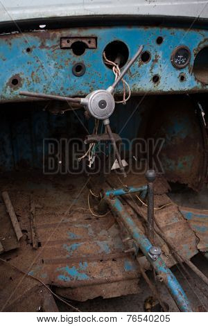 Inside the rusty car.
