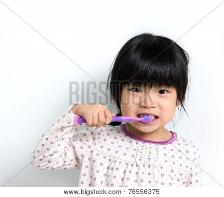 Child Brushing Teeth