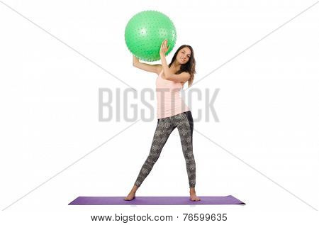 Young woman exercising with swiss ball
