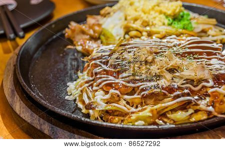 Closeup Cooking Okonomiyaki Or Japan Pizza With Hot Iron Frying Pan