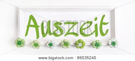 German word for time out in green letters. Concept for relaxation and mental energy.