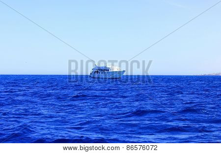 White Ship Floats On Water.