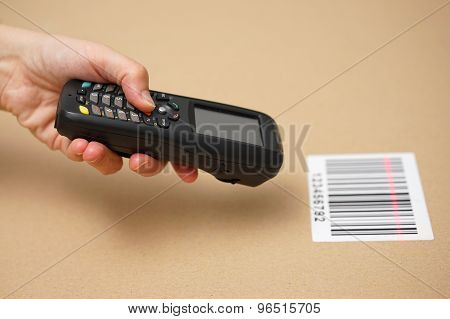 Scanning Label On The Box With Barcode Scanner