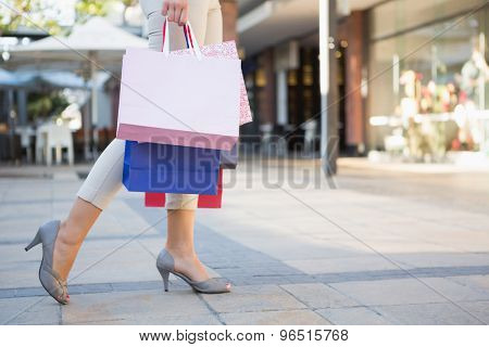 Woman walking with shopping bags at the shoppingmall