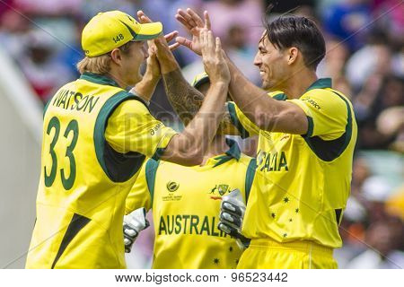 LONDON, ENGLAND - June 17 2013: Shane Watson and Mitchell Johnson celebrate the wicket of Lahiru Thirimanne during the ICC Champions Trophy international cricket match between Sri Lanka and Australia.