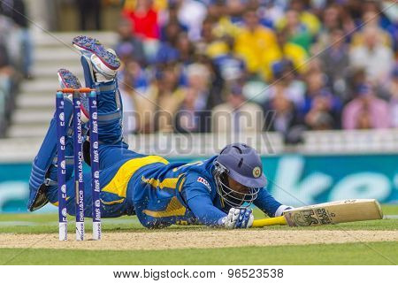 LONDON, ENGLAND - June 17 2013: Sri Lanka's Tillakaratne Dilshan dives in to make his ground during the ICC Champions Trophy international cricket match between Sri Lanka and Australia.