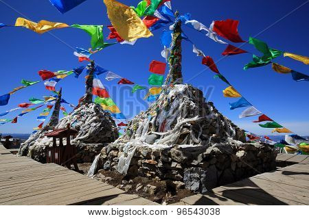 Tibetan buddhist prayer flags on mountain in Shangri-La, China