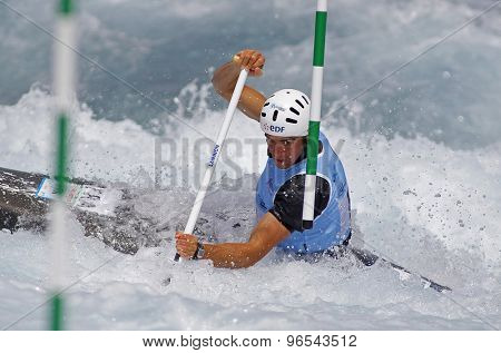 LONDON, ENGLAND - JUNE 06 2014 Jonathan Marc of France competes at the ICF Canoe Slalom held at the Lea Valley White Water centre Waltham Abbey.