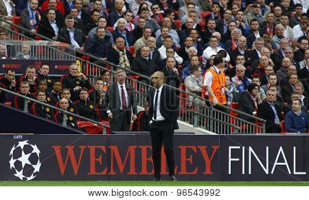LONDON, ENGLAND. May 28 2011: Manchester's manager Sir Alex Ferguson and Barcelona's manager Josep Guardiola during the 2011UEFA Champions League final between Manchester United and FC Barcelona
