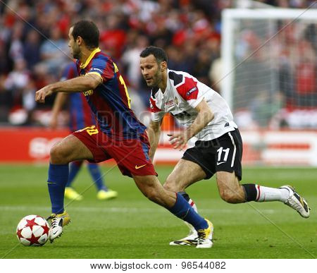 LONDON, ENGLAND. May 28 2011: Barcelona's midfielder Javier Mascherano and Manchester's midfielder Ryan Giggs during the 2011UEFA Champions League final between Manchester United and FC Barcelona