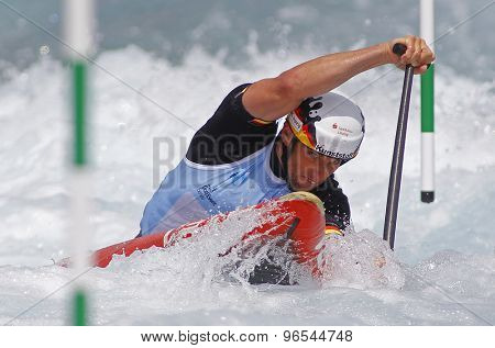 LONDON, ENGLAND - JUNE 06 2014 Jan Benzien of Germany competes at the ICF Canoe Slalom held at the Lea Valley White Water centre Waltham Abbey.