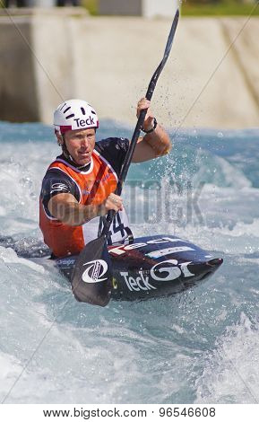 LONDON, ENGLAND - JUNE 06 2014 David Ford of Canada competes at the ICF Canoe Slalom held at the Lea Valley White Water centre Waltham Abbey.