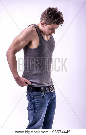 Attractive trendy young man undressing