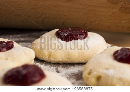 Dough With Marmelade On Wooden Board