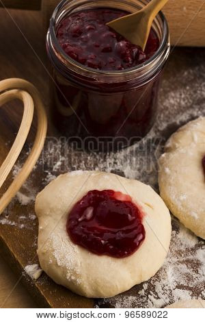 Dough With Marmelade On Wooden Board
