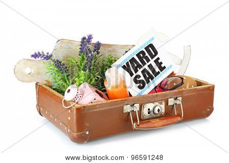 Old suitcase of unwanted stuff ready for yard sale isolated on white
