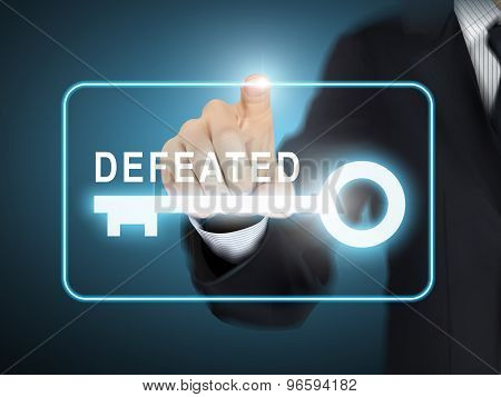 Male Hand Pressing Defeated Key Button