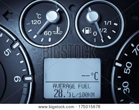 Close up image of a car's dashboard indicating a very high fuel consumption.