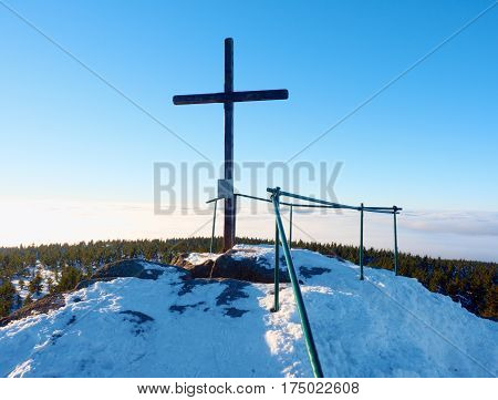 Winter Mountain. Wooden Cross On Rocky Mountain Summit.