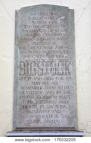 LONDON UK - 16TH FEBRUARY 2017: A memorial plaque on the facade of the Animal War Memorial Dispensary in Kilburn London, on 16th February 2017. It commemorates the deaths inflicted on animals during the Great War.