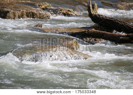 Close-up of cascades and rapids of a fast mountain river