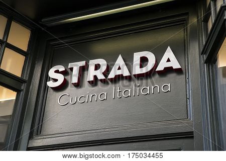CANTERBURY UK - FEBRUARY 13TH 2017: The sign above the entrance to the Strada Italian restaurant in the historic city of Canterbury in Kent, on 13th February 2017.