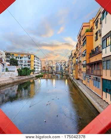 historical jewish quarter in Girona, view through Eiffel Bridge at sunrise, Barcelona, Spain, Catalonia