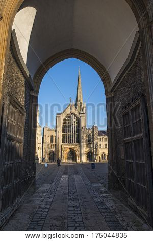 A view of the magnificent Norwich Cathedral through the Erpingham Gate in the historic city of Norwich UK.