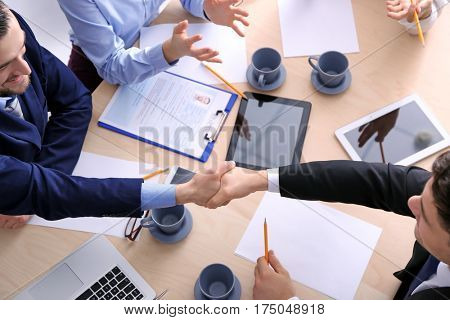 People shaking hands on business interview