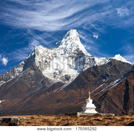 Mount Ama Dablam with stupa near Pangboche village and beautiful cloudy sky - way to mount Everest base camp - Khumbu valley - Nepal