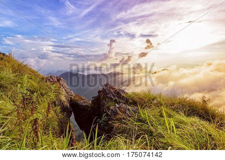 Beautiful landscape nature of high mountain colourful sunlight cloud and sky on Phi Pan Nam Range during sunset in winter from viewpoint Phu Chi Fa Forest Park at Chiang Rai Province Thailand