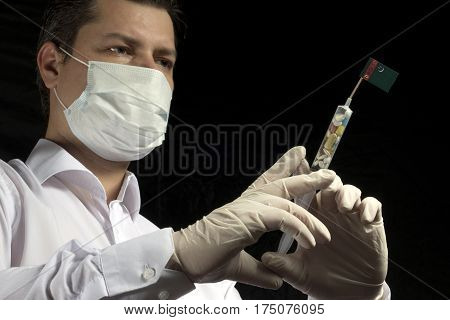 Young Man As A Doctor Gives A Medical Injection To Turkmenistani Flag On A Black Background