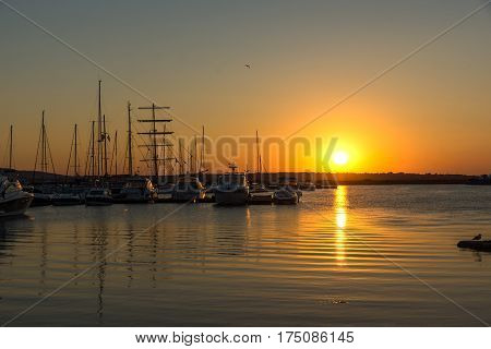 SOZOPOL, BULGARIA - JULY 11, 2016: Amazing Sunset at the port of Sozopol, Burgas Region, Bulgaria