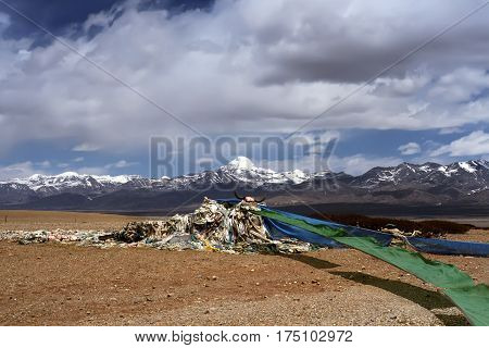 Tibetan prayer flags flutter on the wind at the view point of Sacred Mount Kailash in Barga Valley, Western Tibet.